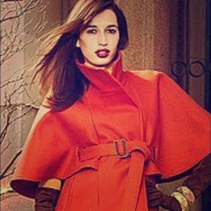 Orange/red jacket. Size XS never worn. Gorgeous.